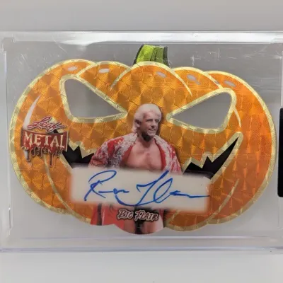 Leaf Metal Halloween jack-o'-lantern die-cut trading card signed by Ric Flair, presented in a protective hard case with a factory seal.