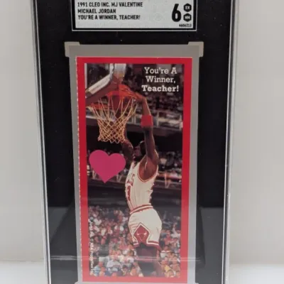 SGC-graded 6 EX/NM 1991 Cleo Inc. Michael Jordan "You're A Winner, Teacher!" Valentine's Day card in a protective slab.