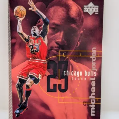 Upper Deck Michael Jordan Chicago Bulls trading card featuring a red background and graphic design elements.