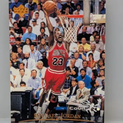 1994-95 Upper Deck Michael Jordan Electric Court parallel trading card, featuring an action shot of Jordan dunking for the Chicago Bulls.
