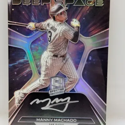Panini Spectra "Deep Space" Manny Machado signed trading card featuring a vibrant holographic finish.