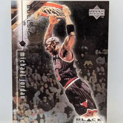 1997-98 Upper Deck Black Diamond Michael Jordan basketball trading card #9. Features Jordan dunking in a Chicago Bulls uniform with...