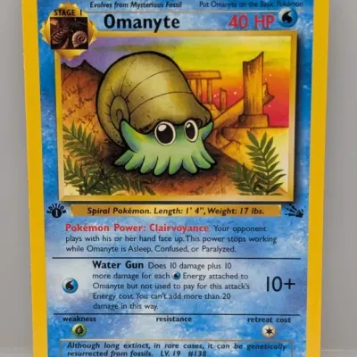 1999 Pokémon Fossil set 1st Edition Omanyte trading card, number 52/62, illustrated by Kagemaru Himeno.