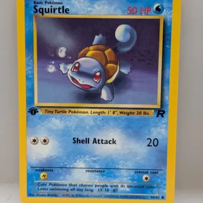 1st Edition Team Rocket Squirtle Pokémon trading card, number 68/82, illustrated by Atsuko Nishida and published by Wizards of the Coast...
