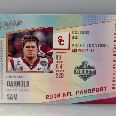 2018 Panini Prestige NFL Passport Sam Darnold rookie trading card featuring his USC Trojans profile.