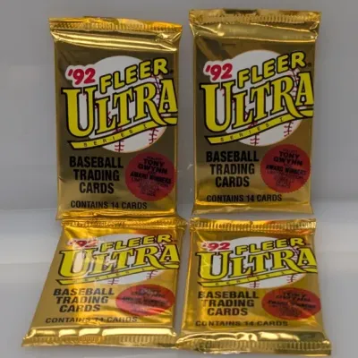 Four sealed wax packs of 1992 Fleer Ultra Series I baseball trading cards in gold foil packaging.