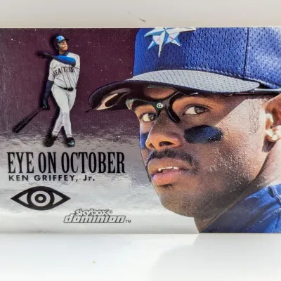 SkyBox Dominion "Eye on October" Ken Griffey Jr. baseball card featuring a metallic silver background and close-up portrait.