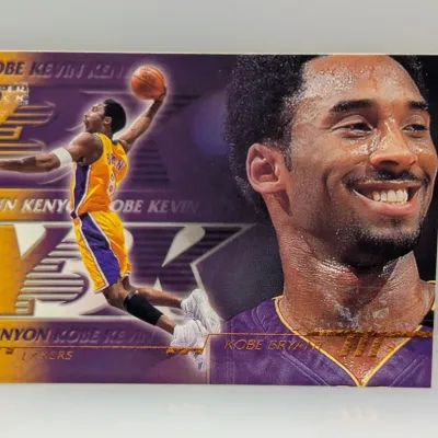 Upper Deck Kobe Bryant Los Angeles Lakers basketball trading card, featuring dual action and portrait graphics.