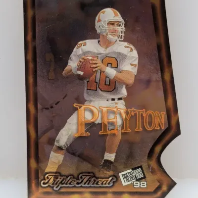1998 Press Pass Triple Threat die-cut Peyton Manning trading card featuring him in his University of Tennessee Volunteers uniform.