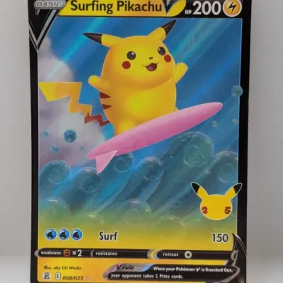 2021 Pokémon Celebrations Surfing Pikachu V trading card, numbered 008/025. The card appears to be in near-mint condition with vivid...