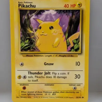 1999 Pokémon Base Set Pikachu trading card, #58/102, illustrated by Mitsuhiro Arita in good condition.