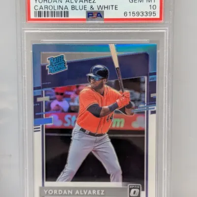 PSA-graded 10 Gem Mint 2020 Donruss Optic Yordan Alvarez Carolina Blue & White #45 Rated Rookie card.