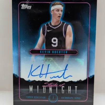 Topps "Stroke of Midnight" Kevin Huerter autographed basketball trading card featuring a certified sticker signature in blue ink.