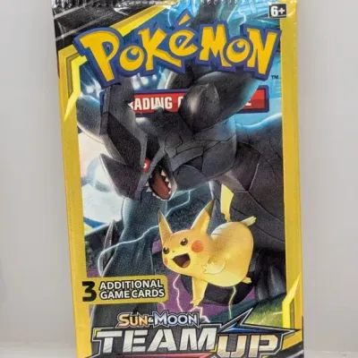 Sealed Pokémon Sun & Moon Team Up 3-card booster pack featuring Zekrom and Pikachu on the foil artwork.