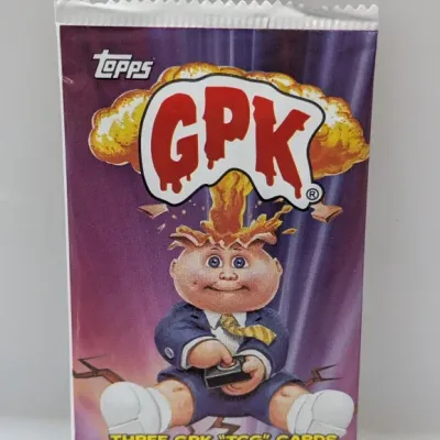 Unopened Topps Garbage Pail Kids (GPK) TCG card foil pack featuring Adam Bomb artwork.