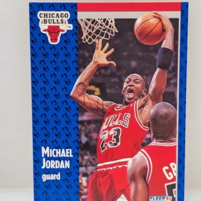 1991 Fleer Michael Jordan basketball card #29 featuring a action shot of him dunking for the Chicago Bulls.