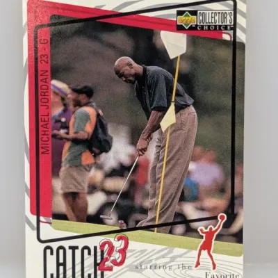 1995-96 Upper Deck Collector's Choice Michael Jordan "Catch 23" trading card #23-G, depicting Jordan putting on a golf...