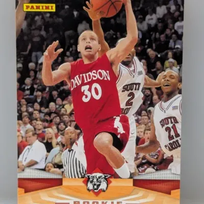 2009-10 Panini Stephen Curry rookie basketball card, featuring him in his Davidson Wildcats uniform, appears to be in clean condition.