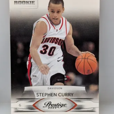 2009 Panini Prestige Stephen Curry rookie basketball card, featuring him in his Davidson College jersey.