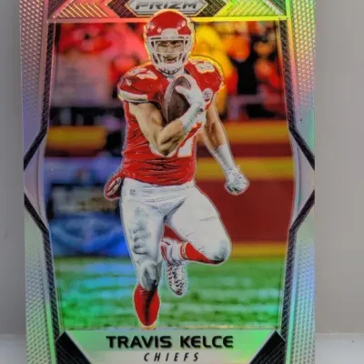Panini Prizm Travis Kelce Kansas City Chiefs trading card featuring a metallic silver holographic finish.