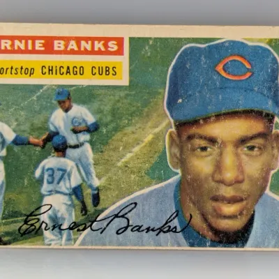 1956 Topps Ernie Banks baseball card (#15), Chicago Cubs, showing light surface wear and minor edge rubbing.