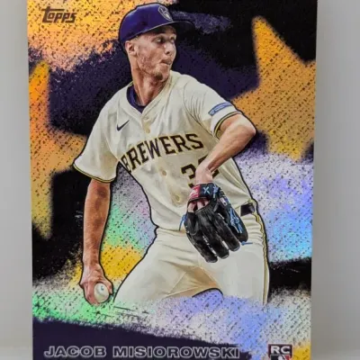 Topps Jacob Misiorowski rookie baseball card featuring a stylized gold background and Milwaukee Brewers uniform.