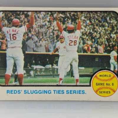 1971 Topps #332 World Series Game 6 baseball card, featuring "Reds' Slugging Ties Series" with Menke and Tolan, showing...