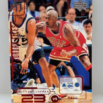 1997-98 Upper Deck 'The Jordan Chronicles' #J10 Michael Jordan trading card featuring him guarding Nick Anderson of the Orlando...