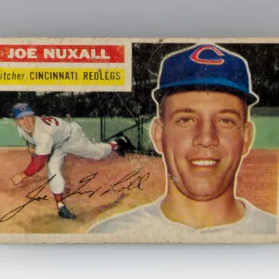 Vintage 1956 Topps Joe Nuxall baseball card #180, pitcher for the Cincinnati Redlegs, showing surface wear and aged edges.