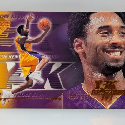 1999-00 Upper Deck Y2K Strength Kobe Bryant trading card #Y3K-G8, featuring purple and gold Los Angeles Lakers graphics.