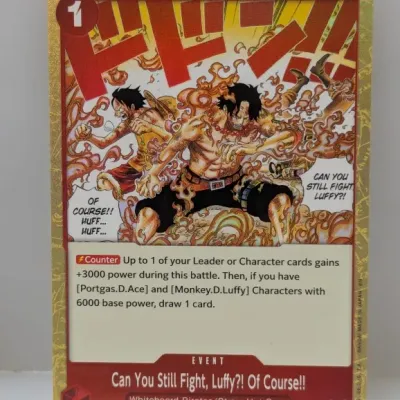 One Piece Card Game Event card titled 'Can You Still Fight, Luffy?! Of Course!!' featuring a gold textured border and full-art...