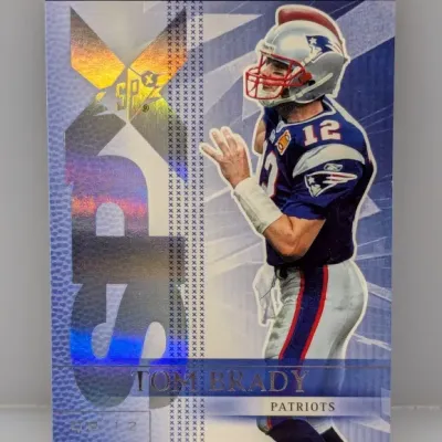 2004 Upper Deck SPx Tom Brady football trading card #88, featuring holographic accents and classic New Patriots uniform imagery.