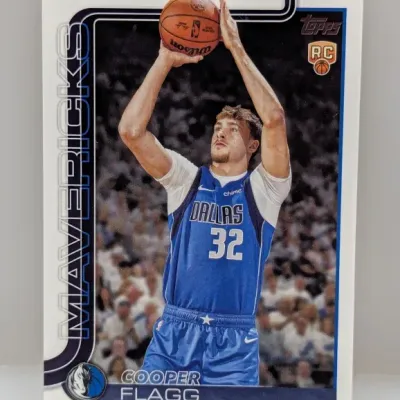 Cooper Flagg Topps rookie trading card featuring him in a Dallas Mavericks uniform.