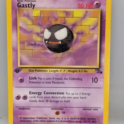 First Edition Gastly Pokémon trading card from the 1999 Fossil set (#33/62), featuring artwork by Mitsuhiro Arita with minor edge wear.