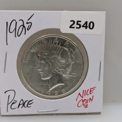 1925 Peace silver dollar coin mounted in a cardboard flip holder labeled with lot number 2540.