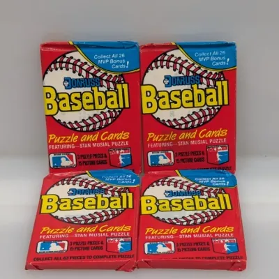 Four unopened wax packs of 1988 Donruss Baseball cards featuring the Stan Musial puzzle, each containing 15 cards and 3 puzzle pieces.