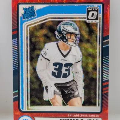 Donruss Optic Cooper DeJean Rated Rookie trading card featuring red glitter parallel borders, in excellent condition.