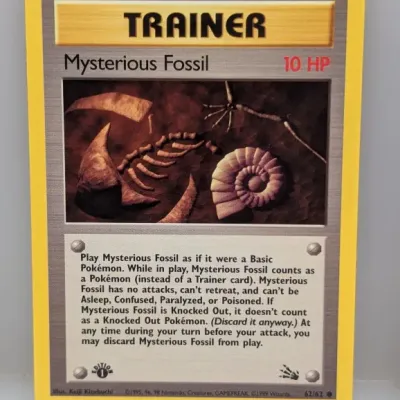 1999 Pokémon Fossil set 1st Edition Mysterious Fossil Trainer card (62/62) in well-preserved condition.