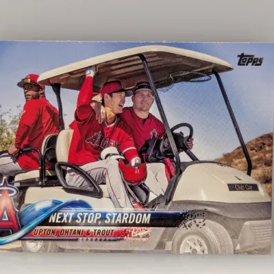Topps trading card featuring Los Angeles Angels players Justin Upton, Shohei Ohtani, and Mike Trout in a golf cart, titled 'Next...