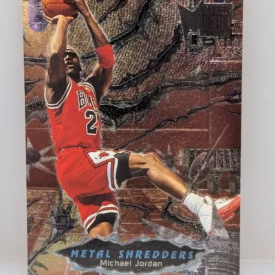 1996-97 Fleer Metal Universe 'Metal Shredders' Michael Jordan trading card #11MS. The card features an embossed foil texture...