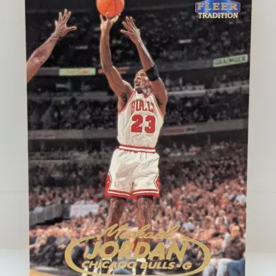 1998-99 Fleer Tradition Michael Jordan basketball trading card #23, featuring him in his white Chicago Bulls uniform.