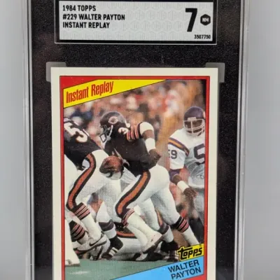 SGC-graded 7 NM copy of 1984 Topps #229 Walter Payton Instant Replay football card in a protective slab.