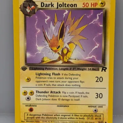 1st Edition Dark Jolteon Pokémon card (38/82) from the 2000 Team Rocket expansion set, illustrated by Mitsuhiro Arita.