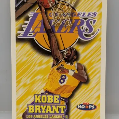 1997-98 NBA Hoops Kobe Bryant #50 basketball trading card featuring him in his #8 Los Angeles Lakers jersey.