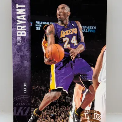 2012-13 Panini Threads Kobe Bryant basketball trading card (#12) featuring him in his purple Los Angeles Lakers jersey.