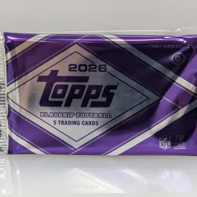 Sealed 2026 Topps Flagship Football hobby exclusive pack containing 5 trading cards in a purple foil wrapper.
