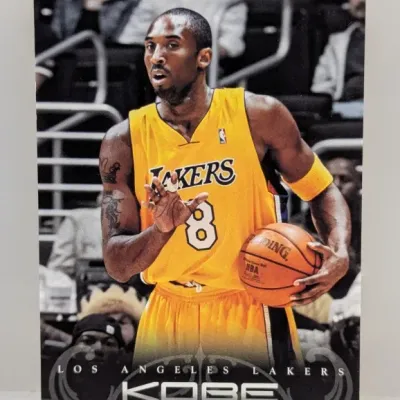 Panini Kobe Bryant Los Angeles Lakers basketball trading card featuring an in-game action shot of Bryant in his number 8 jersey.