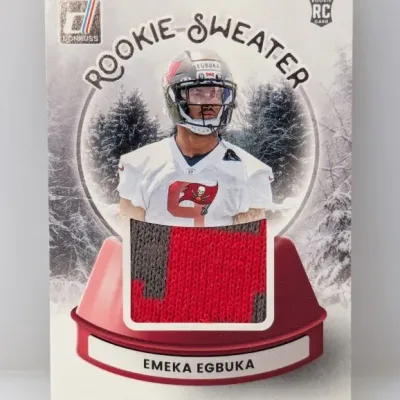 Donruss Rookie Sweater sports trading card featuring Emeka Egbuka with an embedded sweater swatch.