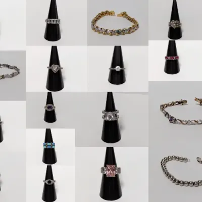 Photo collage featuring a collection of fine jewelry, including gemstone and diamond rings displayed on black ring stands alongside...