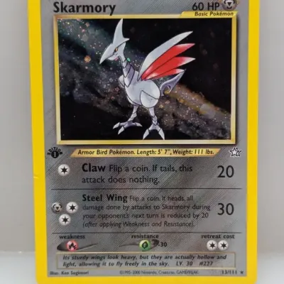 1st Edition Skarmory holographic Pokémon trading card from the Neo Genesis expansion set, number 13/111, circa 2000.